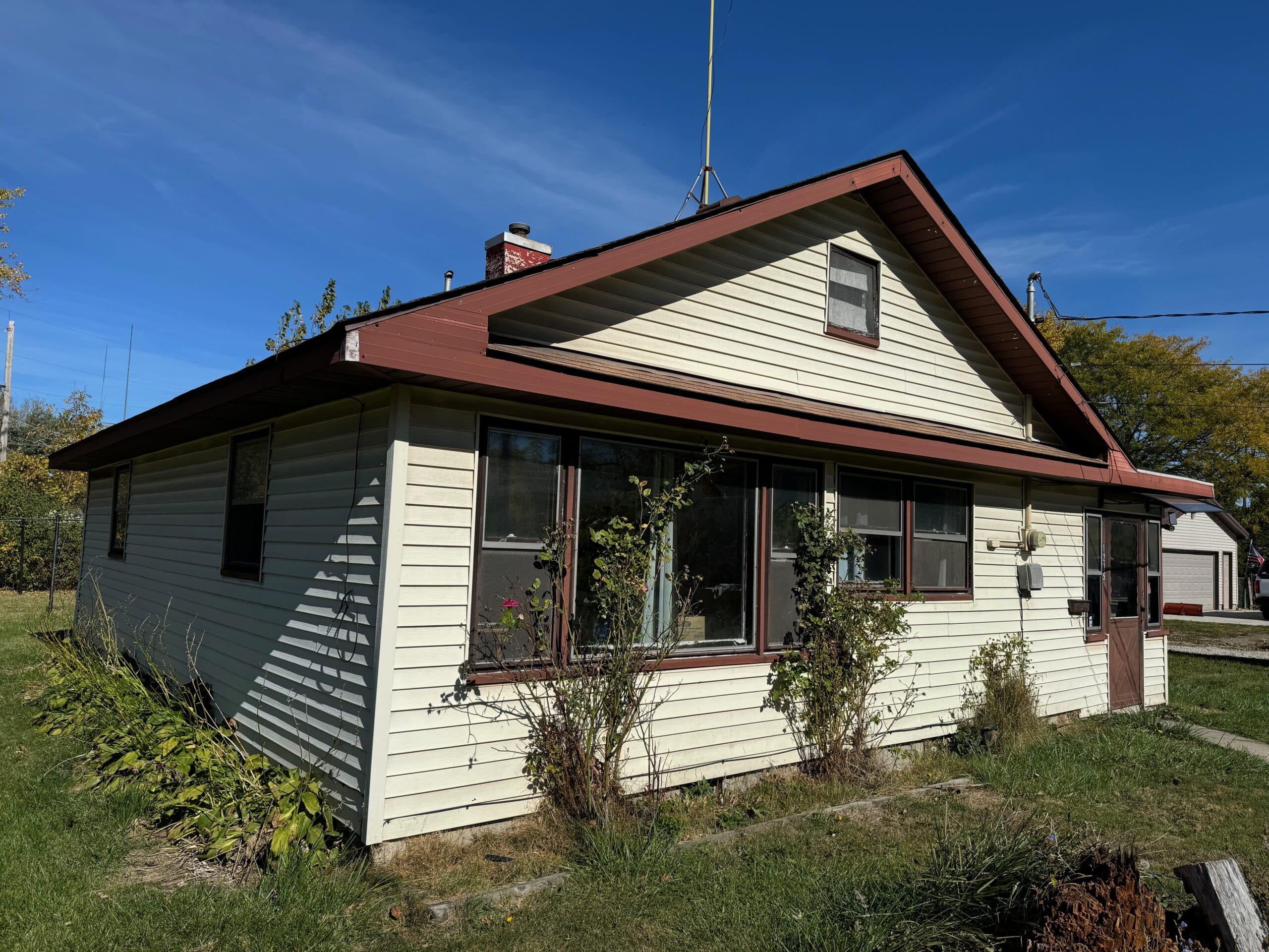Cream sided house with a brown roof in Lansing